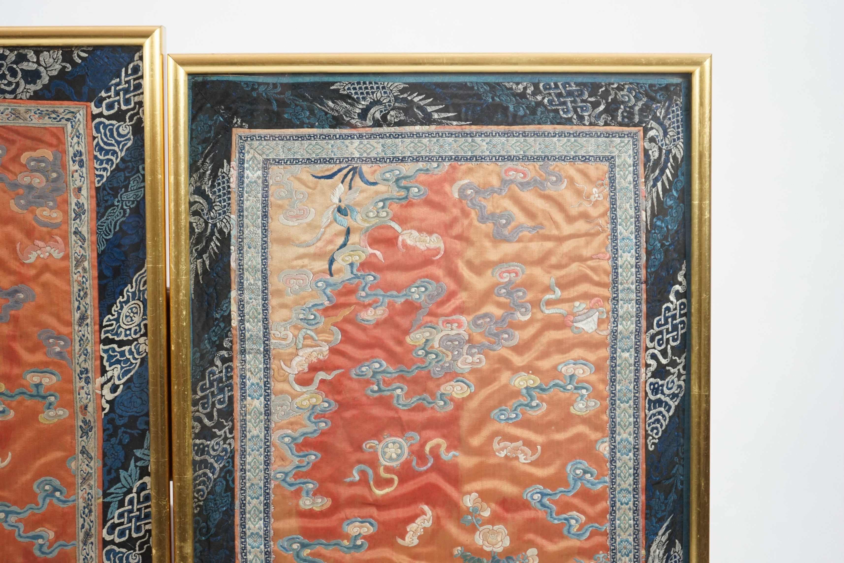 A pair of Chinese coral silk ‘dragon’ panels, 19th century